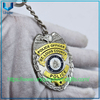 Diseño personalizado Relieve 3D Gold /plata Forma ovalada de dos colores Medalla de recuerdo de electroplacas de dos colores Die de llavero de llaves de la policía de aleación de zinc fundido
