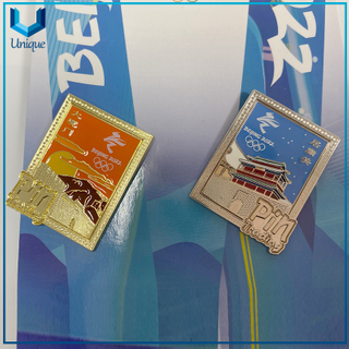 Pin de solapa de juego olímpico de invierno de oro/níquel de alta calidad de diseño personalizado