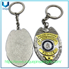 Diseño personalizado Relieve 3D Gold /plata Forma ovalada de dos colores Medalla de recuerdo de electroplacas de dos colores Die de llavero de llaves de la policía de aleación de zinc fundido
