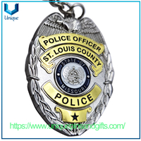 Diseño personalizado Relieve 3D Gold /plata Forma ovalada de dos colores Medalla de recuerdo de electroplacas de dos colores Die de llavero de llaves de la policía de aleación de zinc fundido
